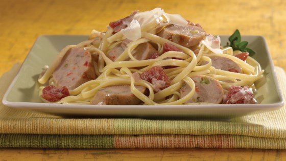 Grilled Sweet Italian Chicken Sausage with Tomato Cream Sauce Over Linguine